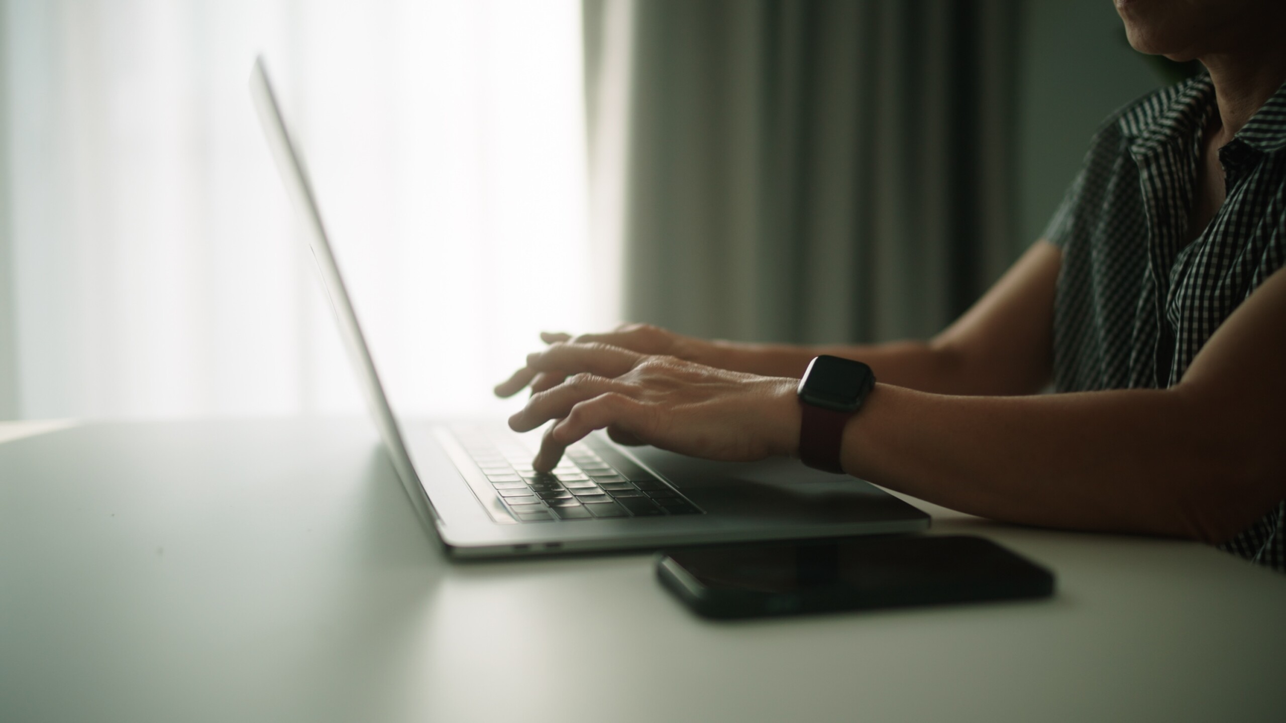 Woman working on her laptop at home.